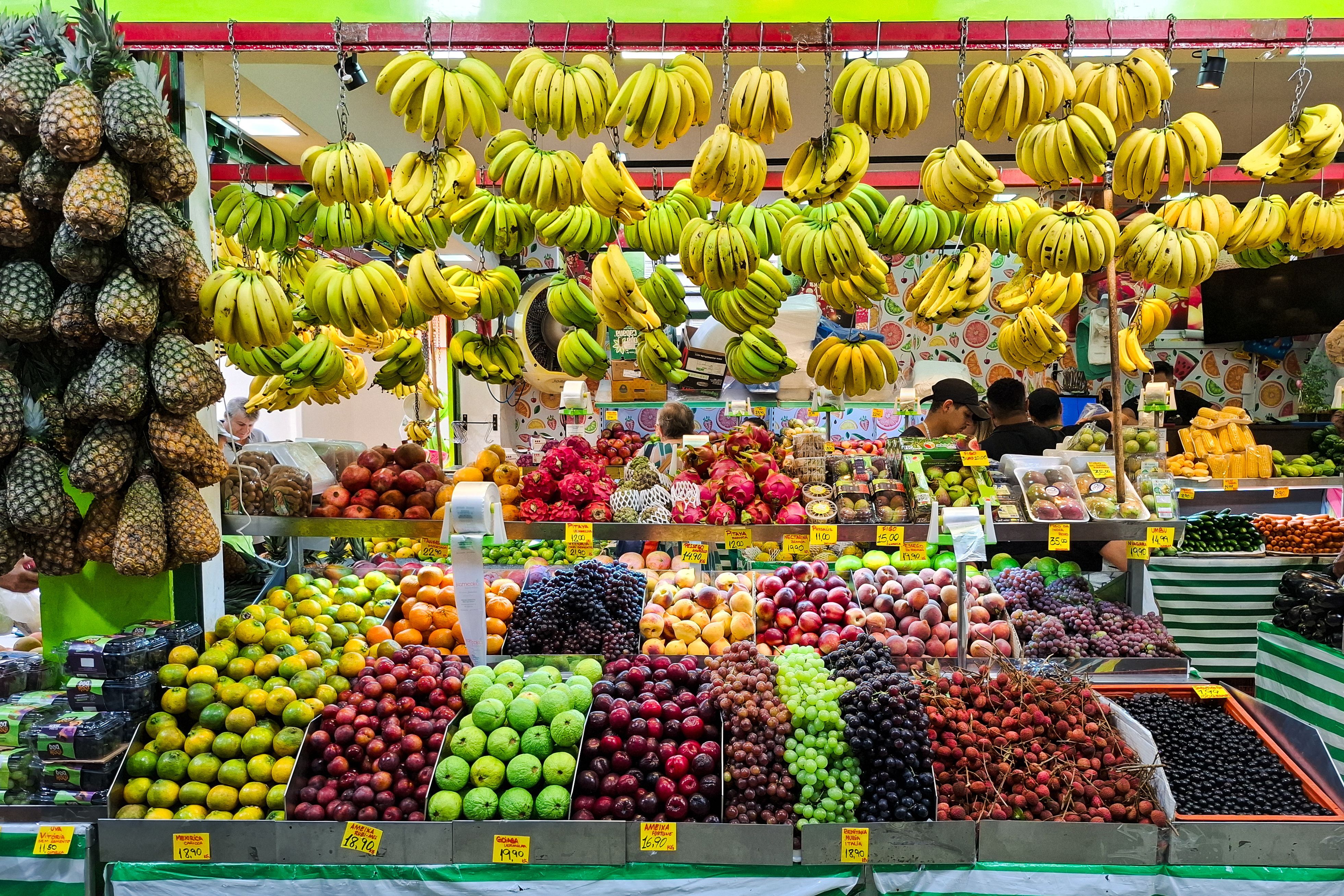 a shopping stall with a selection of fruit and vegetables